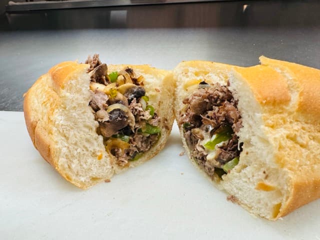 Hand-laid Loin Tail Steak on Fresh Italian Rolls